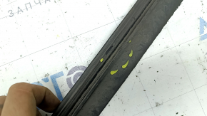 The front bumper lip of the Honda Insight 19-22 has broken fasteners, is worn and deformed