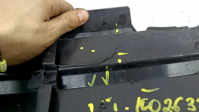 The radiator grille of the Honda Insight 19-22 is bare, black gloss, cracks, non-factory holes, broken fasteners, missing fragments of fasteners