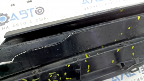 The radiator grille of the Honda Insight 19-22 is bare, black gloss, cracks, non-factory holes, broken fasteners, missing fragments of fasteners