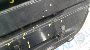 The radiator grille of the Honda Insight 19-22 is bare, black gloss, cracks, non-factory holes, broken fasteners, missing fragments of fasteners