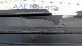 The radiator grille of the Honda Insight 19-22 is bare, black gloss, cracks, non-factory holes, broken fasteners, missing fragments of fasteners