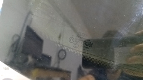 The rear window of the Audi Q8 19-26 trunk door is tinted, covered in soot, there are scratches on the glass, the heating pins are broken, the heating threads are melted
