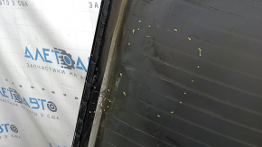 The rear window of the Audi Q8 19-26 trunk door is tinted, covered in soot, there are scratches on the glass, the heating pins are broken, the heating threads are melted
