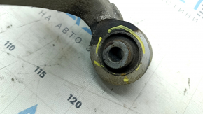The lower front left control arm of a Hyundai Sonata 11-15 hybrid has torn silent blocks and a broken stopper