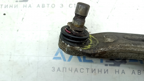 The lower front left control arm of a Hyundai Sonata 11-15 hybrid has torn silent blocks and a broken stopper
