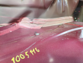 The trunk trough of the Hyundai Sonata 11-15 hybrid on the body is dented