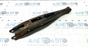 The lower rear left transverse control arm of the Subaru Forester 19-24 SK is rusty