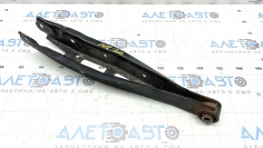 The lower rear left transverse control arm of the Subaru Forester 19-24 SK is rusty