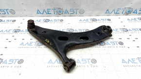 The lower front right control arm of a Subaru Forester 19-24 SK is rusty, the silent block is torn, and it is dented