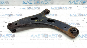 The lower front right control arm of a Subaru Forester 19-24 SK is rusty, the silent block is torn, and it is dented