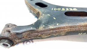 The lower front right control arm of a Subaru Forester 19-24 SK is rusty, the silent block is torn, and it is dented
