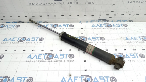 The rear left shock absorber of Toyota Prius V 14-17 is rusty