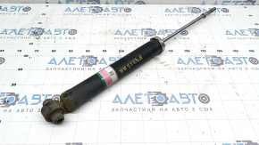 The rear right shock absorber of Toyota Prius V 14-17 is rusty