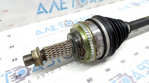 The front left half shaft of a Toyota Camry 92-01 is rusty, with play in the inner CV joint