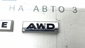 The paint on the SIGNATURE AWD emblem on the Mazda CX-5 22-25 trunk door is peeling off
