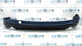 The rear bumper lip of the Mazda CX-5 22-25 is blue, torn, cracked, missing fragments, scratches