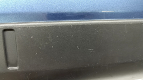 The rear bumper lip of the Mazda CX-5 22-25 is blue, torn, cracked, missing fragments, scratches