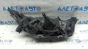 Front left headlight Toyota Rav4 19-25 reflector, black, USA built scratches