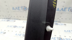 The upper right trunk door trim for a Ford Edge 15-24 is black, the fastener is broken, the plastic has turned white