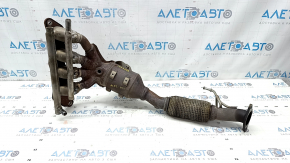 The exhaust manifold with a catalytic converter for a Lincoln MKZ 17-20 hybrid has a torn mesh