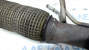 The exhaust manifold with a catalytic converter for a Lincoln MKZ 17-20 hybrid has a torn mesh