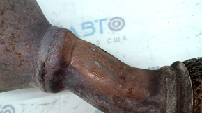 The exhaust manifold with a catalytic converter for a Lincoln MKZ 17-20 hybrid has a torn mesh