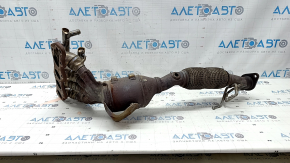 The exhaust manifold with a catalytic converter for a Lincoln MKZ 17-20 hybrid has a torn mesh