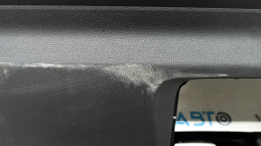 The lower trim of the trunk door of the Subaru Forester 25-26 is black, worn, scratches, needs cleaning, the fastener is drilled out