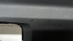 The lower trim of the trunk door of the Subaru Forester 25-26 is black, worn, scratches, needs cleaning, the fastener is drilled out