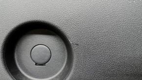 The lower trim of the trunk door of the Subaru Forester 25-26 is black, worn, scratches, needs cleaning, the fastener is drilled out