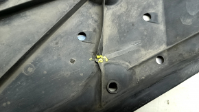 The front right underbody protection of Toyota Venza 21-24 is dented and cracked