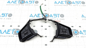 The control buttons on the steering wheel of a Subaru Forester 25-26 are broken