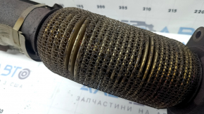 The exhaust pipe with a catalytic converter for Infiniti QX50 19-22 has a torn mesh and is rusty