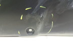 The rear right underbody protection of Toyota Camry v70 18-24 hybrid is dented