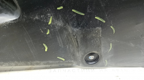 The rear left underbody protection of Toyota Camry v70 18-24 hybrid is dented