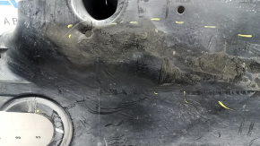 The right underbody protection of the VW Tiguan 18-24 is worn, has tears, cracks, and is dented