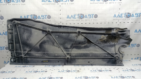 The right underbody protection of the VW Tiguan 18-24 is worn, has tears, cracks, and is dented
