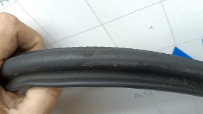 The rear right door opening seal for Audi A3 22-26 is torn and worn