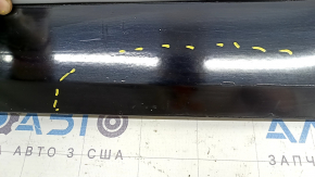 The lower rear right door trim of the Audi Q5 80A 21-25 is painted, after repair, cracked