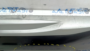 The lower rear right door trim of the Audi Q5 80A 21-25 is painted, after repair, cracked