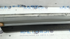 The lower rear right door trim of the Audi Q5 80A 21-25 is painted, after repair, cracked