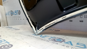 The bare hood of a Hyundai Kona 18-23 1.6, 2.0 bump, dented corner