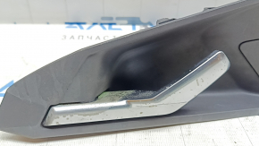 The inner rear right door handle of an Audi A3 22-26 is black, with a plug, scuffs, chrome is peeling, the mount is broken
