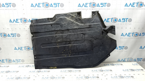 The rear left underbody protection of BMW X5 G05 19-23 is dented and torn