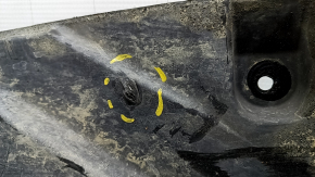 The rear left underbody protection of BMW X5 G05 19-23 is dented and torn