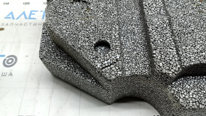 The foam plastic under the spare tire of a Volvo XC60 18-26 is crushed and broken