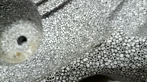 The foam plastic under the spare tire of a Volvo XC60 18-26 is crushed and broken