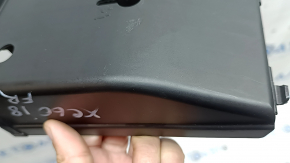 The under-dash fuse box cover for Volvo XC60 18-26 is worn, the fastening is broken, there are scratches
