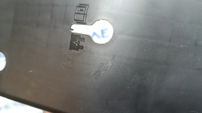 The under-dash fuse box cover for Volvo XC60 18-26 is worn, the fastening is broken, there are scratches