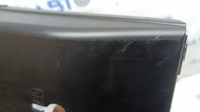 The under-dash fuse box cover for Volvo XC60 18-26 is worn, the fastening is broken, there are scratches